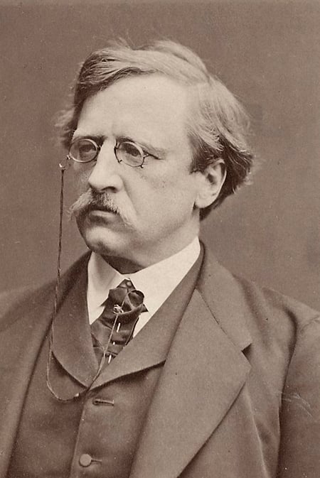 mann i dress med briller